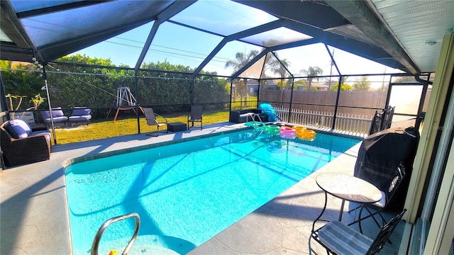 view of swimming pool with a lanai, a patio, an outdoor hangout area, and a yard