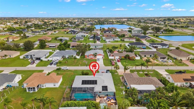 drone / aerial view with a water view