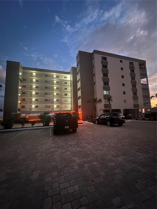 view of outdoor building at dusk