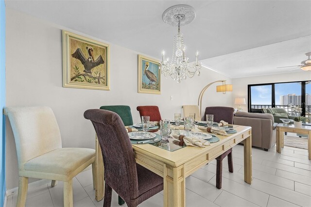 2532 Estero Blvd Unit 607, Fort Myers Beach, FL 33931 - dining space with a chandelier, light tile patterned flooring, and ceiling fan