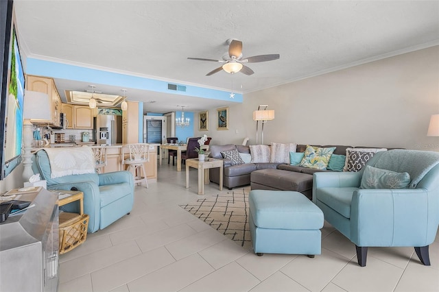 living room with crown molding, ceiling fan with notable chandelier, and light tile patterned floors