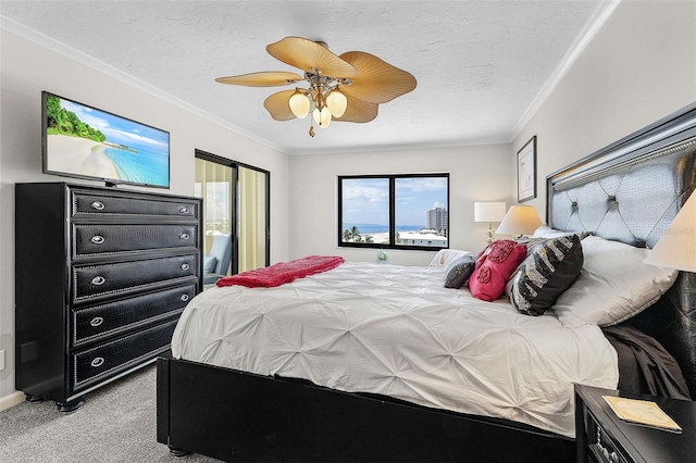 carpeted bedroom featuring crown molding, a textured ceiling, and ceiling fan