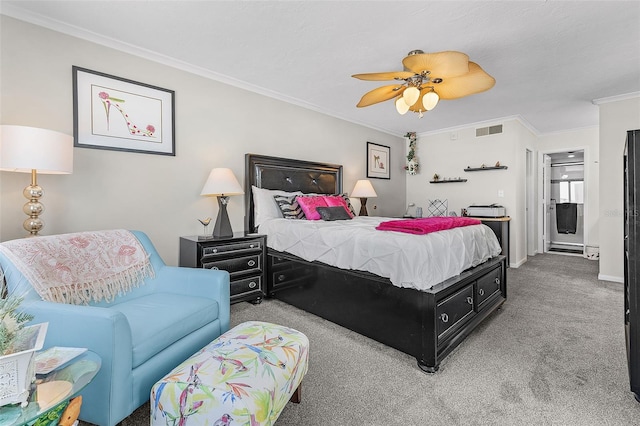 carpeted bedroom featuring ornamental molding and ceiling fan