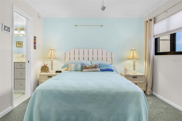 carpeted bedroom featuring crown molding