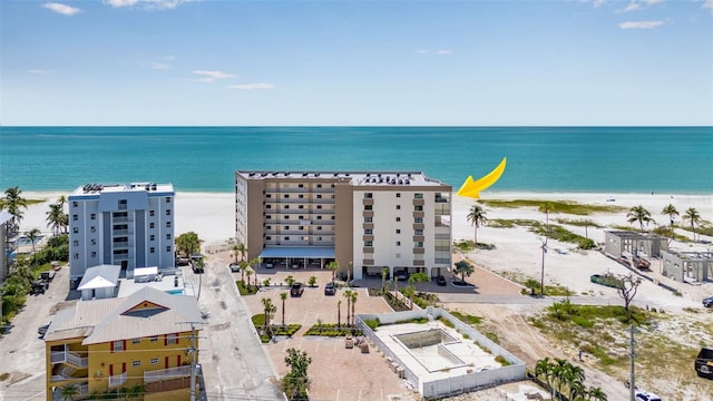 bird's eye view with a water view and a beach view