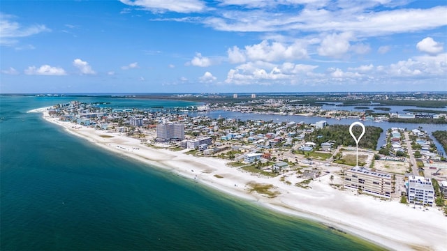 bird's eye view featuring a water view and a beach view