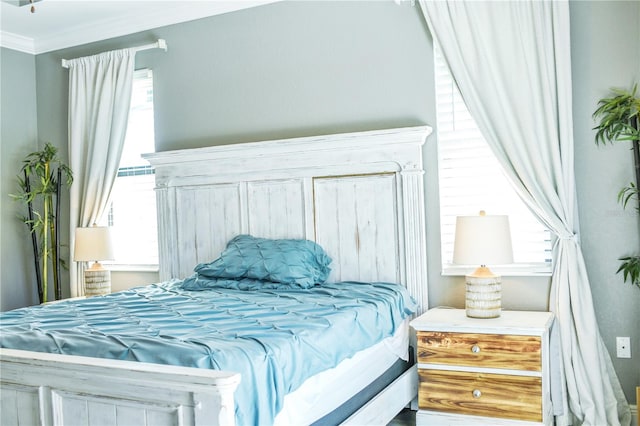 bedroom featuring crown molding