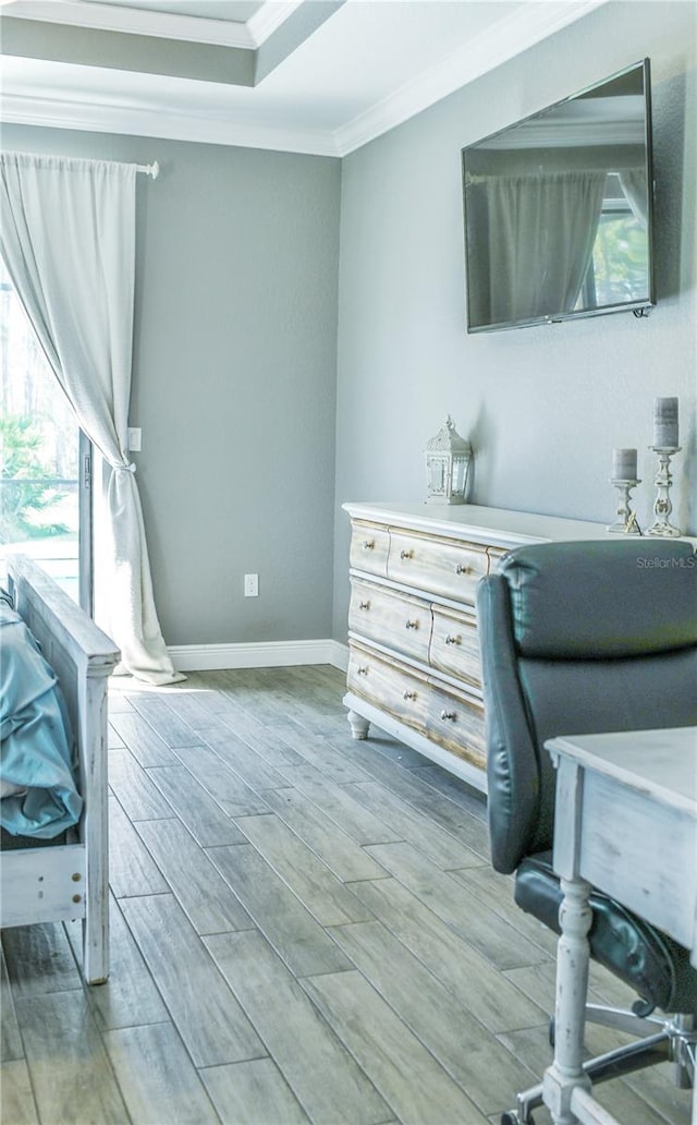 office area with ornamental molding, a wealth of natural light, and hardwood / wood-style floors