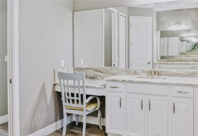 bathroom with vanity and hardwood / wood-style flooring