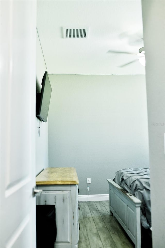 bedroom featuring ceiling fan and light wood-type flooring