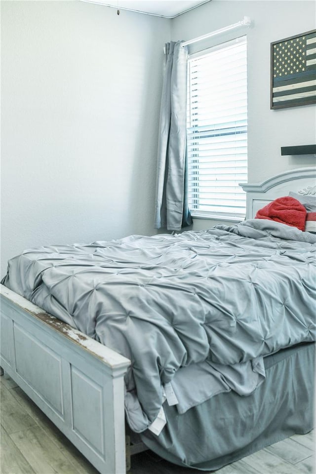 bedroom with light hardwood / wood-style flooring