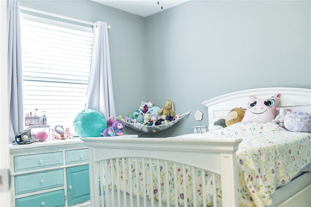 bedroom featuring multiple windows