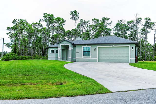 view of front of property featuring a garage and a front lawn