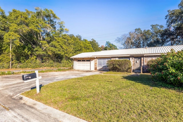 exterior space with a front yard and a garage