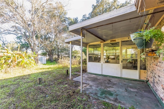 view of yard featuring a sunroom