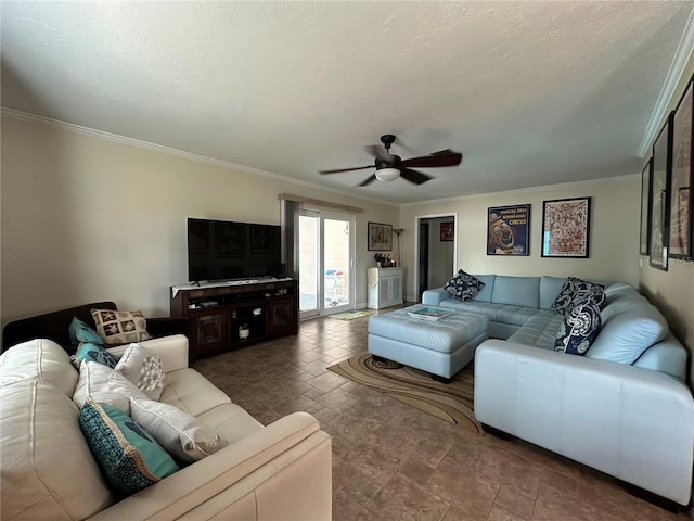 living room with ceiling fan and ornamental molding