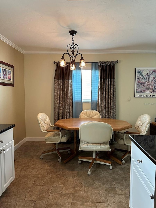 dining area with a chandelier and ornamental molding