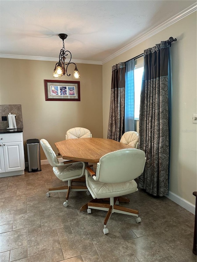 dining area featuring ornamental molding and a notable chandelier