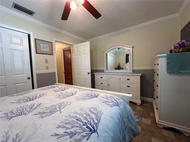 bedroom with ceiling fan and ornamental molding