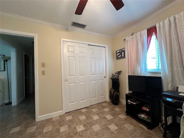 interior space featuring ceiling fan and crown molding