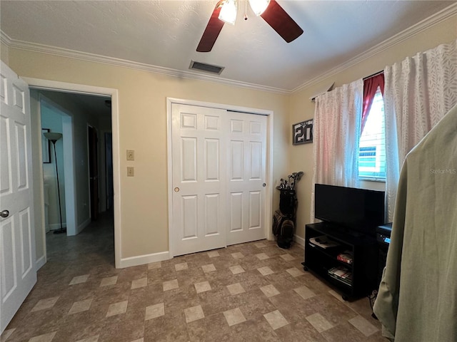 bedroom with ceiling fan, a closet, and ornamental molding