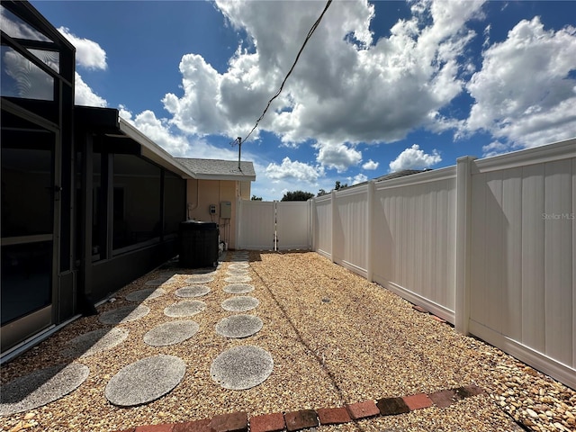 view of yard with central air condition unit