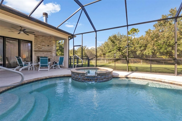 view of pool featuring ceiling fan, an in ground hot tub, and a patio