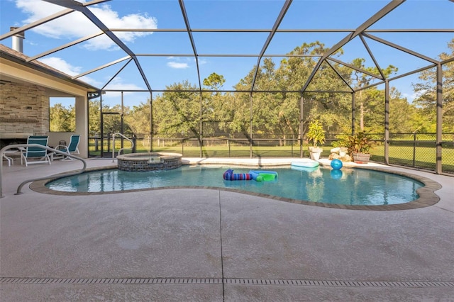 view of pool featuring an in ground hot tub, a patio, and a lanai