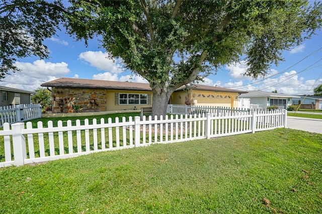 ranch-style home with a front yard