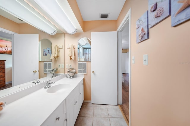 bathroom with tile patterned flooring and vanity