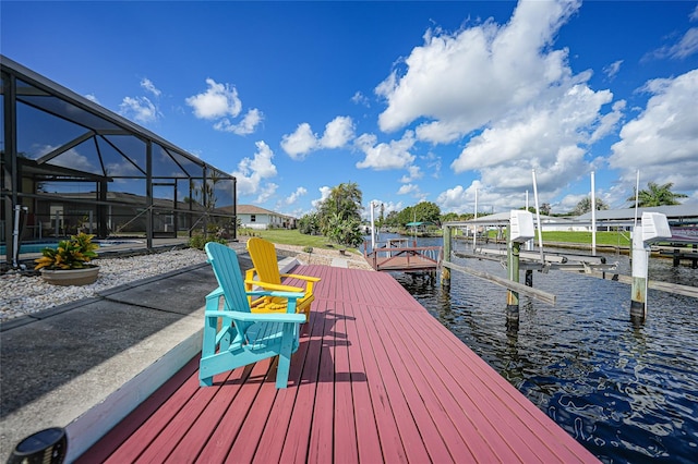 view of dock with a water view and a lanai