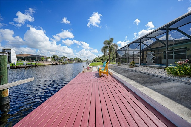 view of dock featuring a water view and a lanai