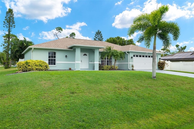 single story home featuring a garage and a front lawn