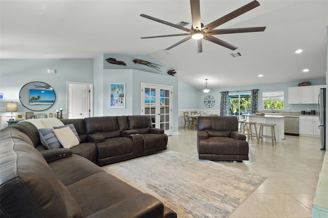 living room featuring french doors, ceiling fan, lofted ceiling, and light tile patterned flooring