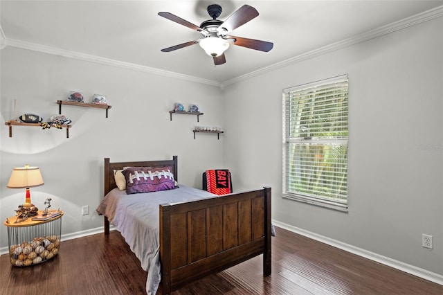 bedroom featuring ceiling fan, dark hardwood / wood-style floors, and crown molding