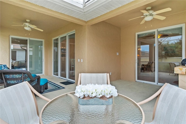 view of patio featuring ceiling fan