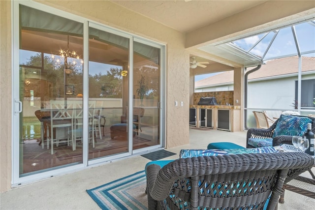 view of patio / terrace featuring glass enclosure and ceiling fan