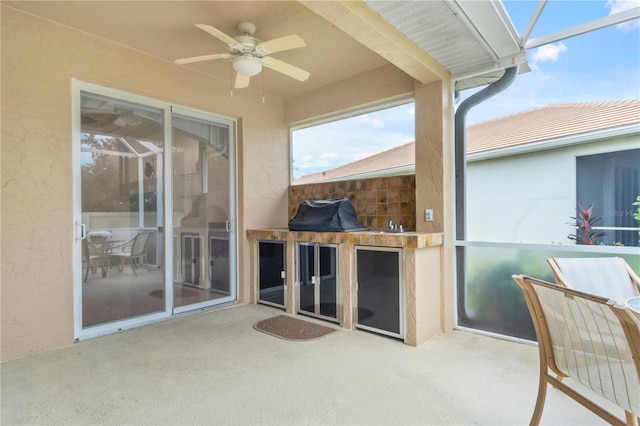 view of patio / terrace featuring ceiling fan