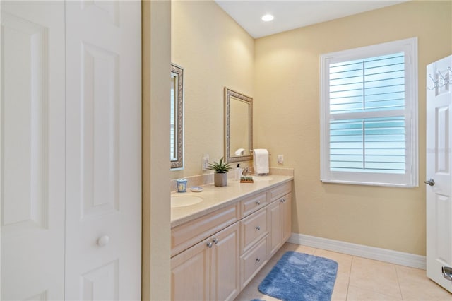 bathroom with vanity and tile patterned flooring