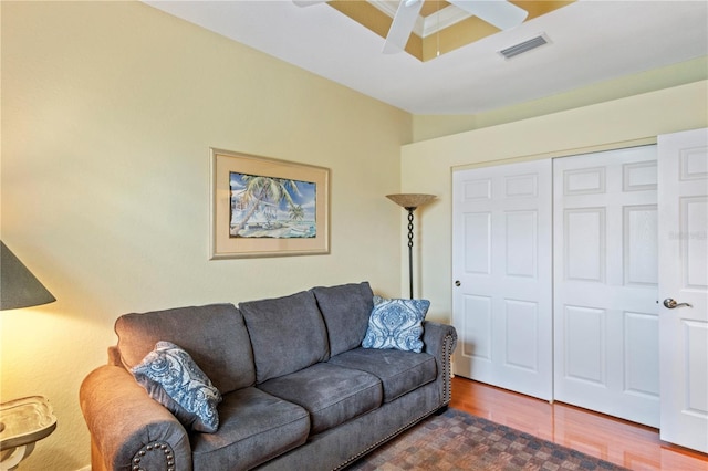 living room with ceiling fan and hardwood / wood-style floors