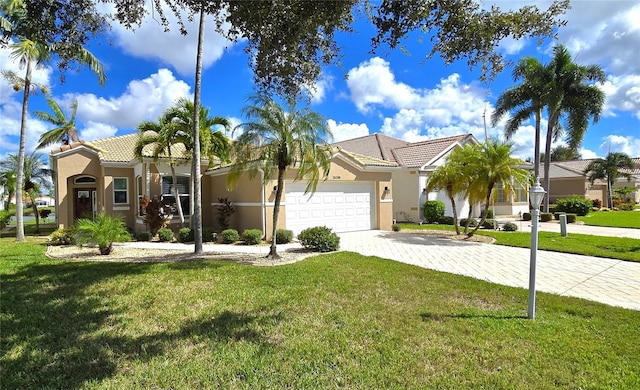 view of front of house featuring a garage and a front lawn