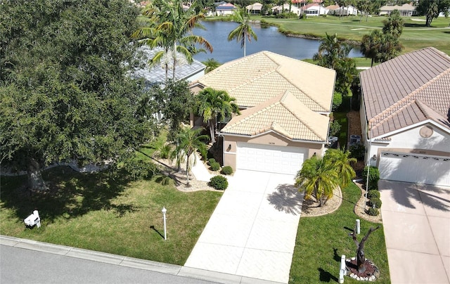 drone / aerial view with a water view