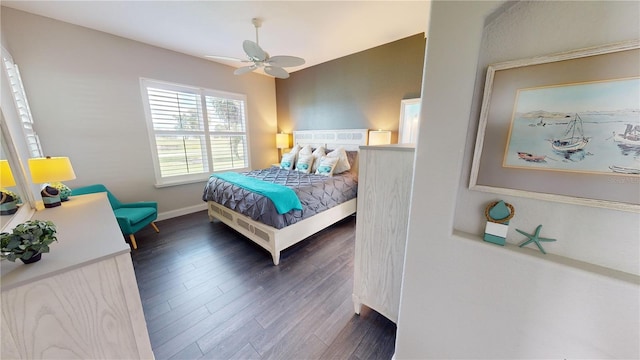 bedroom featuring ceiling fan and dark hardwood / wood-style floors