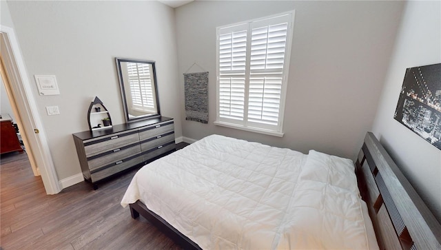 bedroom with hardwood / wood-style floors