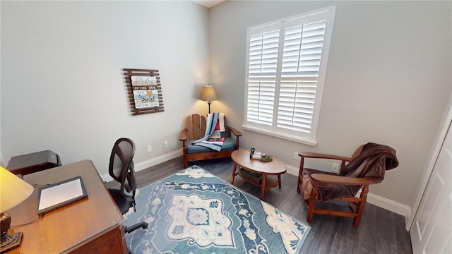 home office with dark hardwood / wood-style flooring