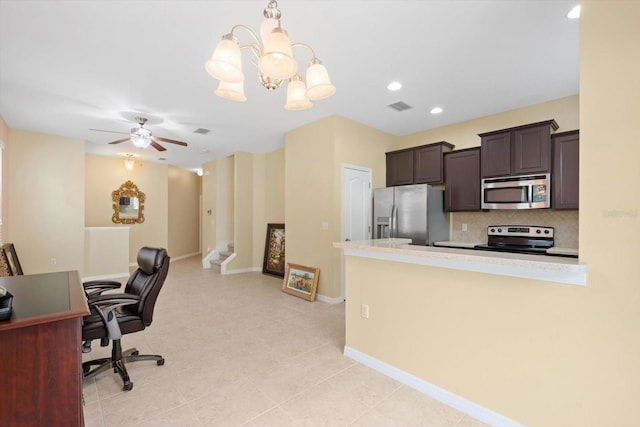 home office with ceiling fan with notable chandelier and light tile patterned floors