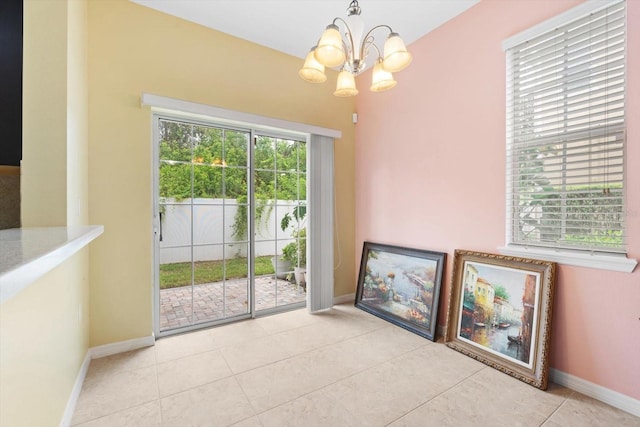 interior space featuring a notable chandelier and light tile patterned floors