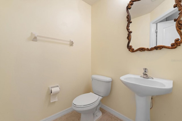 bathroom featuring tile patterned floors and toilet