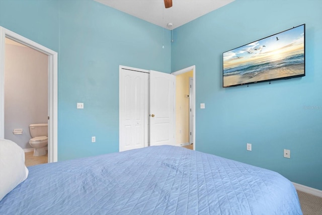 carpeted bedroom with a closet, ceiling fan, and connected bathroom