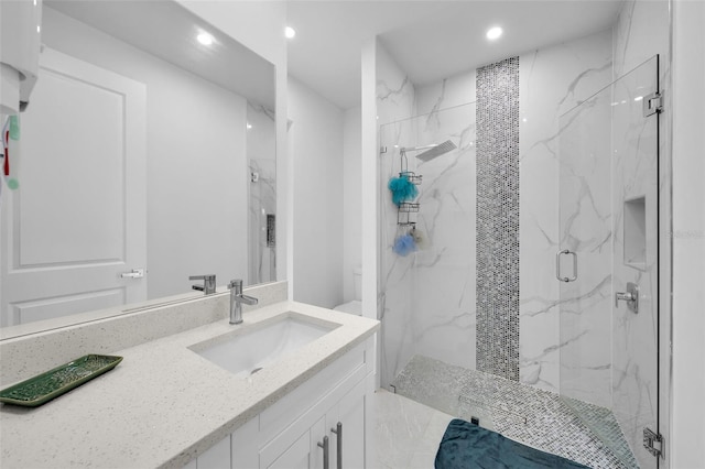 bathroom featuring vanity, toilet, and an enclosed shower